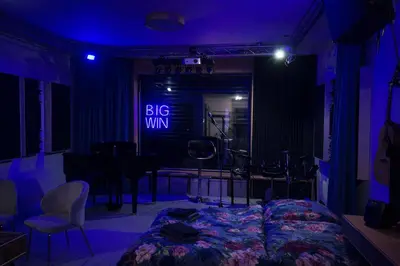 a bedroom with a bed and a big win sign at House Big Win Mělník in Mlazice