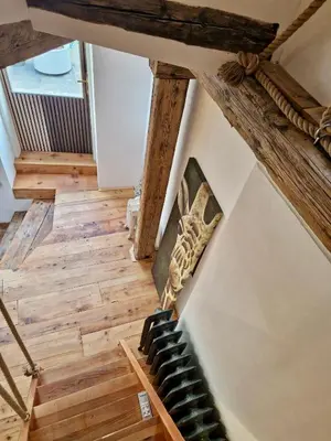 an overhead view of a staircase in a house with wooden floors at Large-Elegant-Central-terrace apartment in Prague
