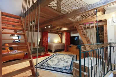 a room with a bunk bed and a staircase at Large-Elegant-Central-terrace apartment in Prague