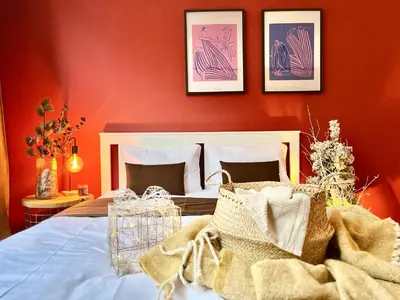 a table topped with a blanket and a basket at Ruby Prague Apartment in Prague