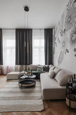 a living room with a couch and a table at Francouzská Suites in Prague