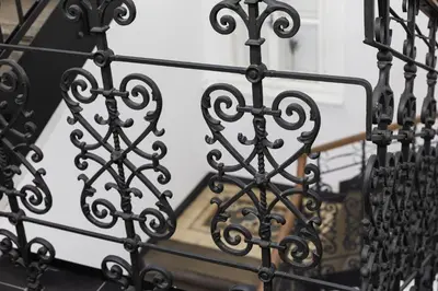 a black iron fence with a stair case at Hotel Ambiance in Prague