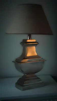 a lamp sitting on top of a table at Chic Prague Living at Vista Serenity Apartment with Balcony in Prague