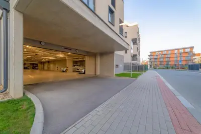 an empty street in front of a building at Chic Prague Living at Vista Serenity Apartment with Balcony in Prague