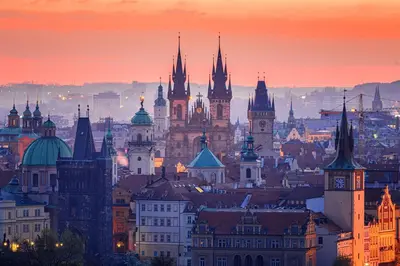 a view of a city at sunset at Chic Prague Living at Vista Serenity Apartment with Balcony in Prague