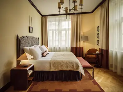a bedroom with a large bed and a window at Sir Prague, part of Sircle Collection in Prague