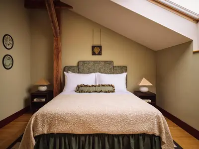 a bedroom with a large bed and two night stands at Sir Prague, part of Sircle Collection in Prague