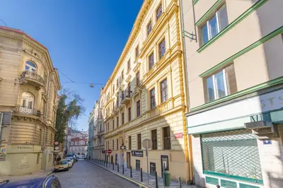 a city street with buildings on the side of the road at Skyview Haven in Prague