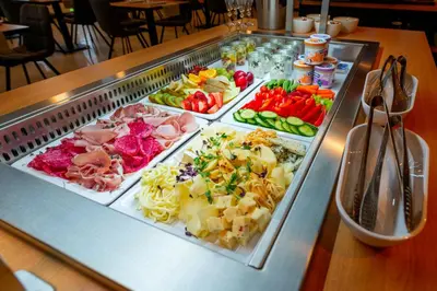 a buffet of different types of food on a table at Hotel NOBILIS - Mladá Boleslav in Bradlec