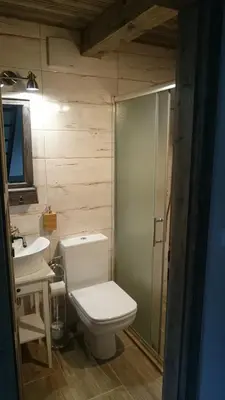 a bathroom with a toilet and a sink at Apartmány Vilekula Sázava in Sázava