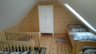 a room with two bunk beds and a staircase at Apartmány Vilekula Sázava in Sázava