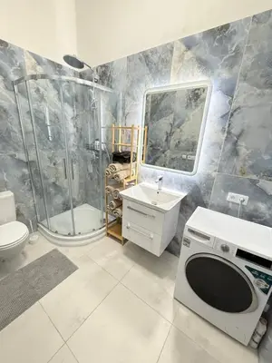 a bathroom with a shower and a toilet and a sink at Stunning apartment in middle of Wenceslas Square in Prague