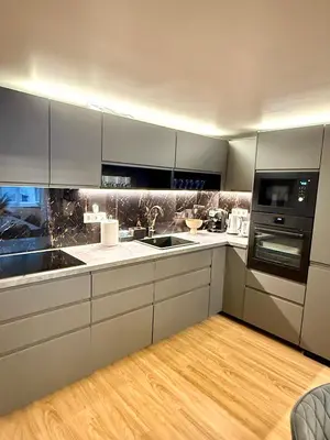 a kitchen with white cabinets and a sink at Stunning apartment in middle of Wenceslas Square in Prague
