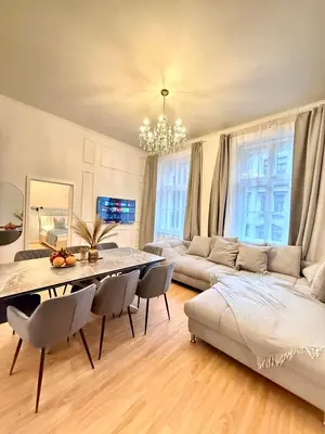 a living room with a table and a couch at Stunning apartment in middle of Wenceslas Square in Prague