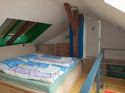 a bedroom with a bed in a attic at Podkrovní hnízdečko in Prague