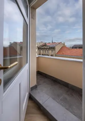 a balcony with a view of a city at Modern & Stylish Apartments Ječná in Prague