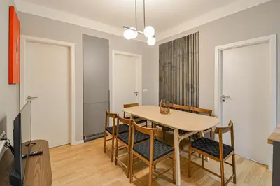 a dining room with a table and chairs at Japanese Design 3BDR Apartment in a Vibrant Area in Prague