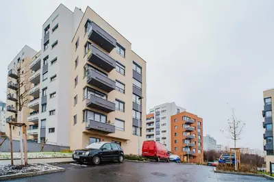 a car parked in a parking lot in front of a building at Blueground Chodov New build free parking PRG-41 in Prague