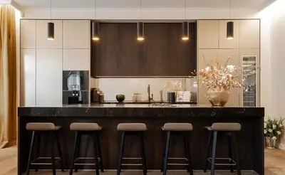 a kitchen with a large counter with stools at OLD TOWN LUXURY 3bd APARTMENT in Prague