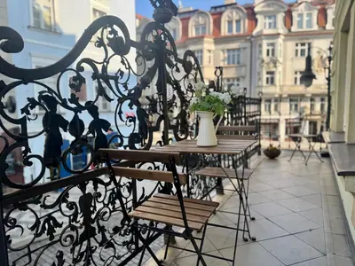a christmas tree on a balcony in a city at Studio Melichar Trost in Prague