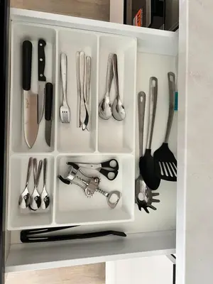 a drawer full of utensils in a refrigerator at Japandi Pearl Designed Studio,Parking ,Aircon, O2 in Prague