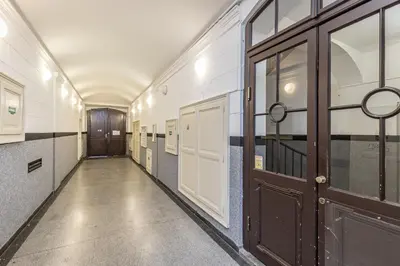 an empty hallway with a door in a building at Antiveli Residence in Prague