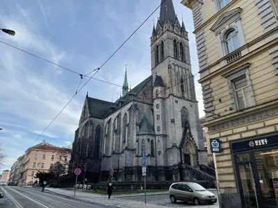 an old church with a clock tower on a street at La casa Prokop in Prague