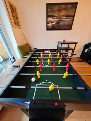 a row of billiard tables in a room at Sauna Apartement, 3 bedrooms, Praha 8 in Prague