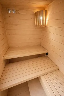 a sauna with wooden shelves in a small room at Sauna Apartement, 3 bedrooms, Praha 8 in Prague