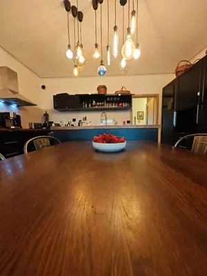 a bowl of fruit on a wooden table in a kitchen at Sauna Apartement, 3 bedrooms, Praha 8 in Prague