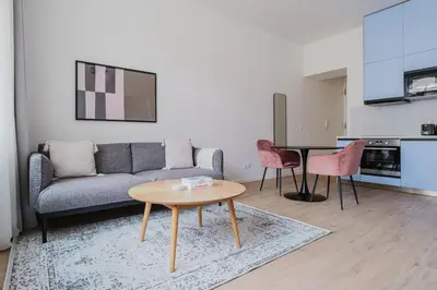 a living room with a couch and a table at Blueground Prague 2 renovated Riegrovy sady PRG-30 in Prague
