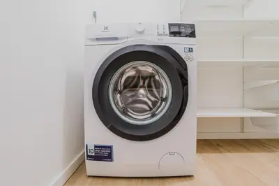 a white washing machine sitting in a room at Blueground Prague 2 renovated Riegrovy sady PRG-30 in Prague