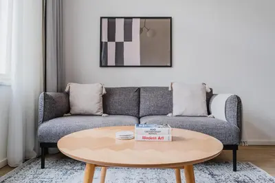 a living room with a couch and a table at Blueground Prague 2 renovated Riegrovy sady PRG-30 in Prague