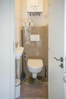 a bathroom with a toilet and a sink at The Spot Apartment in Prague