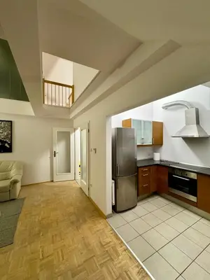 a kitchen with a stainless steel refrigerator in a room at Dalimilova Apartments in Prague