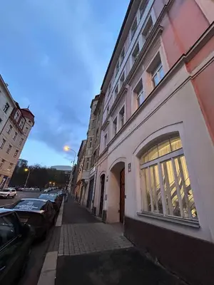 a building on a street with cars parked next to it at Vysehrad studio near the Congress Centre, new bed in Prague