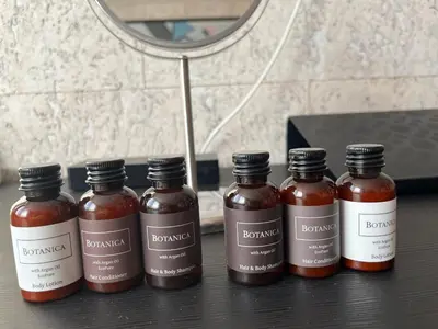a group of four bottles of honey on a table at Best Residence Expo in Prague