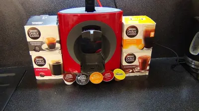 a coffee maker on a counter with two boxes of coffee at Best Residence Expo in Prague