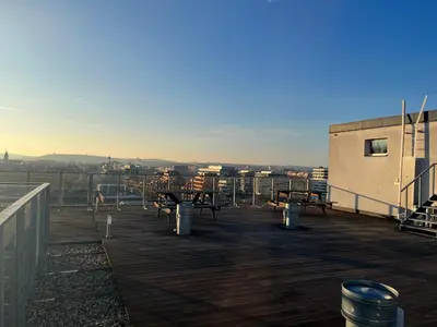 a deck with benches on top of a building at Best Residence Expo in Prague