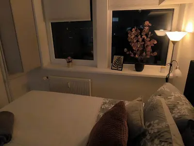 a bedroom with a window and a bed with pillows at Apartmán Pohoda in Prague