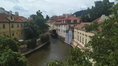 a view of a river in a city with buildings at Apartmán Pohoda in Prague