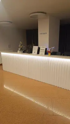 a white counter in a room with signs on it at Apartmán Pohoda in Prague
