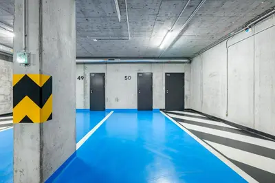 an empty bowling alley with blue lanes at Prague Days - Studio with Terrace and Garage in Modern Building in Prague