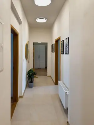 a hallway of an office building with a hallway at 100m2 Wenceslas Comfort, 3BDR with Netflix in Prague