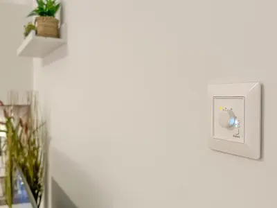 a white electrical outlet on a white wall at Cozy Apartment by Wenceslas Square and Main Train Station in Prague
