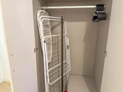 a walk in closet with a metal cage at Cozy Apartment by Wenceslas Square and Main Train Station in Prague
