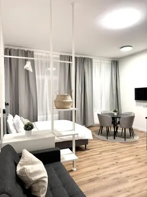 a living room with a couch and a table at Mystical 2-bed Apartment in heart of Prague in Prague