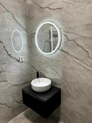 a bathroom with a white sink and a mirror at Mystical 2-bed Apartment in heart of Prague in Prague