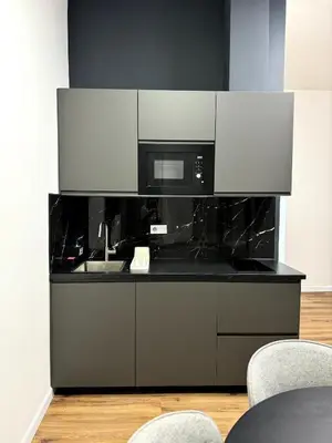 a kitchen with a sink and a microwave at Mystical 2-bed Apartment in heart of Prague in Prague