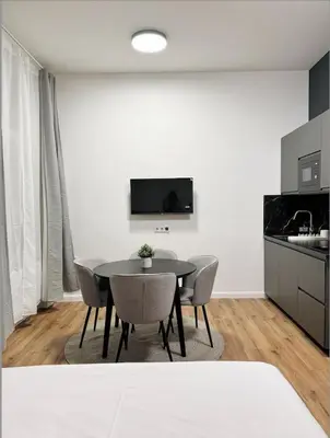 a kitchen and dining room with a table and chairs at Mystical 2-bed Apartment in heart of Prague in Prague
